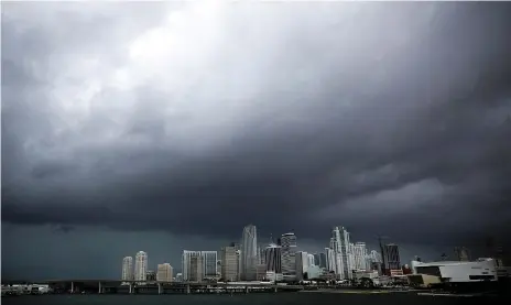  ?? Reuters ?? Dark clouds over Miami’s skyline before the arrival of Hurricane Irma to South Florida yesterday