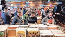  ?? RICK WOOD / MILWAUKEE JOURNAL SENTINEL ?? Throngs of vinyl lovers will crowd into Acme Records & Music Emporium Saturday for Record Store Day.