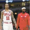  ?? ARMANDO L. SANCHEZ/CHICAGO TRIBUNE ?? DeMar DeRozan (11) and Patrick Beverley walk on the court during the second quarter against the Philadelph­ia 76ers on Wednesday.