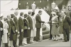  ?? Jerry Rife San Diego Union Tribune ?? QUEEN ELIZABETH II is greeted by California Gov. George Deukmejian upon her arrival in San Diego in 1983 as part of a statewide tour.