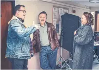  ??  ?? Russell T Davies on the set of "It's a Sin" with Shaun Dooley and Keeley Hawes, who play Ritchie's parents.
