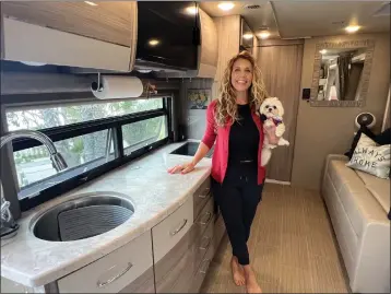  ?? COURTESY OF WENDY VALENTINE ?? “After my kids left home and my divorce, the definition of home changed for me,” said Wendy Valentine, pictured in her RV with her dog Daisy.