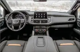  ??  ?? The Yukon’s interior design progress from one generation to the next is dramatic. It would be more unified if GMC cut down the number of fonts it uses on the dials, switches and displays. Check out that wide console in the redesigned edition.