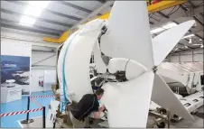  ?? ?? An engineer works on a three-blade ducted propeller of an Airlander 10 prototype, at the Hybrid Air Vehicles centre, in Bedford, England.