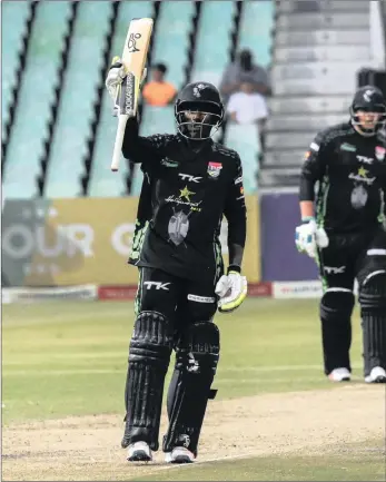  ??  ?? MAN FOR THE MOMENT: Dolphins all-rounder Senuran Muthusamy raises his bat after scoring 50 runs in the Momentum One Day Cup final earlier this month.