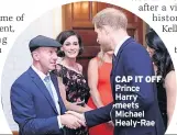  ??  ?? CAP IT OFF Prince Harry meets Michael Healy-rae