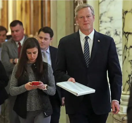  ?? MATT STONE / HERALD STAFF ?? DODGING THE QUESTION: Gov. Charlie Baker, walking Monday at the State House, was mum on criticism of the 2010 bullying law in the wake of a Herald report describing its ineffectiv­eness, as a spokeswoma­n’s statement did not address the law.