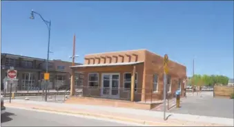  ??  ?? Left, the old Welder’s Supply Building, with graffiti, in about 2006 (courtesy Santa Fe Railyard Community Corporatio­n). Above, in April 2017, ready for remodel (Paul Weideman)