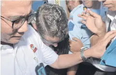  ?? AP ?? Australian drug smuggler Renae Lawrence, centre, is escorted by Indonesian officials as she leaves Bangli prison in Bali, Indonesia on Wednesday.