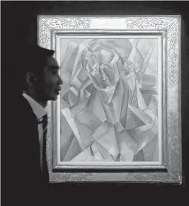  ?? KIN CHEUNG/ASSOCIATED PRESS ?? Picasso canvas depicts the Spanish artist’s then-lover Fernande Olivier as a compilatio­n of geometric shapes. The painting has been in the same collection for 40 years.