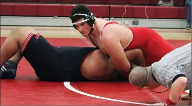  ?? MIKE BUSH/NEWS-SENTINEL ?? Lodi wrestler Ben Bishop, top, looks at the referee as he pins down Lincoln's Adrian Guzman in their 285-pound class match at The Inferno on Jan. 10. Bishop won by pin.