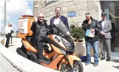  ?? (Courtesy United Hatzalah) ?? ALAN DERSHOWITZ sits atop the motorcycle that he and his friends recently donated to United Hatzalah.