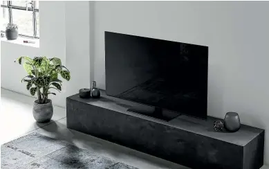  ??  ?? Panasonic’s flat, heavy, metal pedestal base is incredibly sturdy while minimising the TV’s footprint for easy placement.