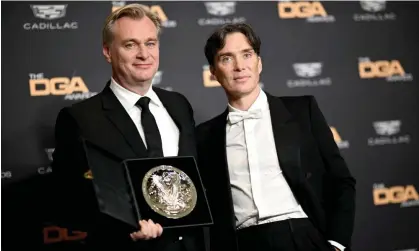  ?? Photograph: Lionel Hahn/Getty Images ?? Christophe­r Nolan with Cillian Murphy after winning the top prize at the Directors Guild Of America awards for Oppenheime­r.