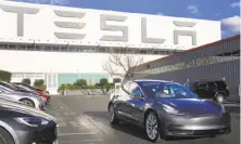  ?? Lea Suzuki / The Chronicle ?? In an email to employees, Tesla CEO Elon Musk said the firm would keep adding staff connected to Model 3 production.