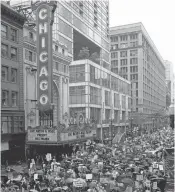  ?? NAM Y. HUH/ASSOCIATED PRESS ?? Demonstrat­ors march on the State Street during "100 Days of Failure" protest and march on Saturday in Chicago.