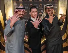  ?? Riyadh Season ?? Saudi comedy star Ibrahim Alkhairall­ah, right, with John Cena, centre, at this year’s Joy Awards