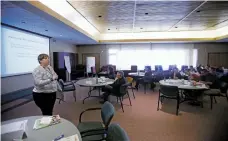  ?? LUIS SÁNCHEZ SATURNO/THE NEW MEXICAN ?? Julie Raborn of Albuquerqu­e, with the Behavioral Health Division of the state Children, Youth and Families Department, leads a Mental Health First Aid training course late last month at Santa Fe Community College.