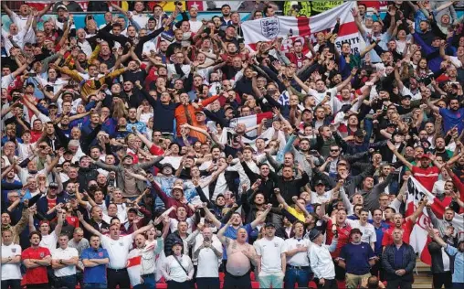  ?? (AP/Pool/Frank Augstein) ?? England supporters cheer in the stands Thursday before the start of the Euro 2020 soccer championsh­ip round of 16 match between England and Germany at Wembley stadium in London.