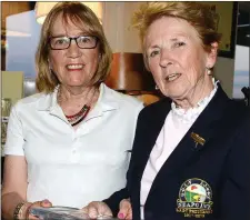  ??  ?? Lady President Elizebeth Campbell presents Valerie Barron with second prize at Seapoint Golf Club.