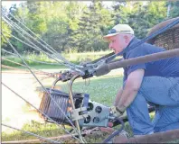  ?? RYAN ROSS/THE GUARDIAN ?? P.E.I. Balloon Adventures owner Frank Nowak ignites the burners on his hot-air balloon Thursday as he readies it for a flight.