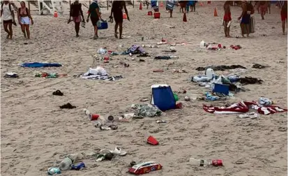  ?? DENNIS POLICE DEPARTMENT ?? According to officials, on July 4, loud, intoxicate­d crowds left an “extraordin­ary amount of trash” on beaches in Falmouth and Dennis.