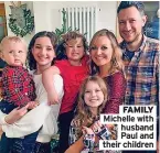  ?? ?? FAMILY Michelle with husband Paul and their children