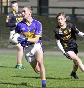  ??  ?? Seán Redmond of St. Mary’s (Rosslare) breaking away from Tadhg McDonald.