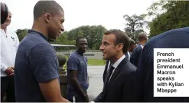 ??  ?? French president Emmanuel Macron speaks with Kylian Mbappe