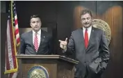  ?? Erik Verduzco Las Vegas Review-Journal ?? NEVADA GOV. Brian Sandoval, left, with Heller, expanded Medicaid under the Affordable Care Act, making him popular with many of his constituen­ts.