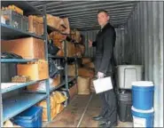  ?? TANIA BARRICKLO—DAILY FREEMAN ?? In this Freeman file photo, Det. Lt. Dirk Budd of the Ulster County Sheriff’s Office points to the corner of a trailer holding 300 pounds of marijuana, processed and unprocesse­d, that was seized from several homes in Marlboroug­h in late June.