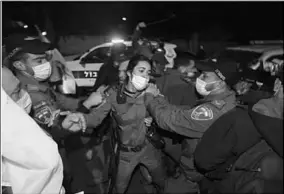  ??  ?? Israeli security forces clash with protesters during a demonstrat­ion against Israeli Prime Minister Benjamin Netanyahu outsidehis official residence in West Jerusalem. (Photo:Al Jazeera)