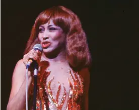  ?? ?? Tina Turner in 1980 wearing the flame dress designed by Bob Mackie. Photograph: Gai Terrell/Redferns