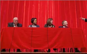  ?? Steph Chambers/Post-Gazette ?? Martin Schmotzer, Olivia Benson, Pam Iovino and Bob Solomon are posed a question by moderator and KDKA-TV’s Jon Delano during the Democratic 37th Senatorial District debate on Saturday at Moon Area High School.