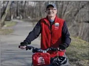  ?? BEN HASTY — MEDIANEWS GROUP ?? John Wolfe, a Schuylkill River Trail Ambassador on the trail with his bike. At Riverfront Park in Pottstown. The Schuylkill River Trail runs through the park.