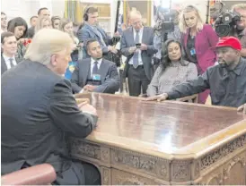  ?? SAUL LOEB/AFP VIA GETTY IMAGES ?? Kanye West meets with President Donald Trump in the Oval Office on Oct. 11, 2018.