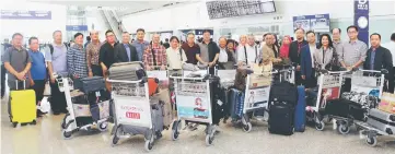  ??  ?? The state delegation upon arrival at Hong Kong Internatio­nal Airport yesterday. Abdul Karim is at second right, Talib at ninth right, and Sudarsono at eighth left.