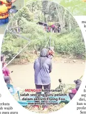  ??  ?? MENGUJI keberanian salah seorang guru pelatih dalam aktiviti Flying Fox merentasi sungai.