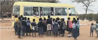  ??  ?? Students greet some of the youngsters they met during their trip to Zambia.