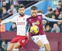  ?? ?? Manchester United’s Bruno Fernandes (left), and Aston Villa’s Matty Cash vie for the ball during the English Premier League soccer match between Aston Villa and Manchester United at the Villa Park stadium in Birmingham, England. (AP)