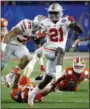  ?? ASSOCIATED PRESS FILE ?? Ohio State wide receiver Parris Campbell escapes the reach of Clemson linebacker Chad Smith during the Fiesta Bowl on Dec. 31.