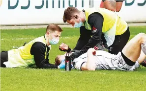  ??  ?? Controvers­y: Ollie Thorley receives attention before being sent off for clashing with Rob Miller