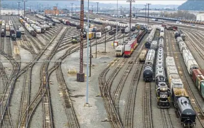  ?? Andrew Rush/Post-Gazette ?? Trains and train cars in Norfolk Southern's Conway Yard in April in Freedom. The former Conrail yard is one of the largest yards in the United States.