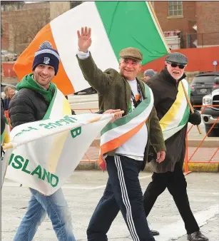  ?? File photo by Ernest A. Brown ?? Attorney General Peter F. Kilmartin, a former Pawtucket police officer, waves while marching in Pawtucket’s annual St. Patrick’s Day Parade last year.