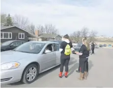  ??  ?? Students with SADD make stops to issue positive tickets.
