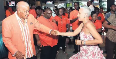  ??  ?? Robert Pickersgil­l dances with Suzanne Constantin­e.