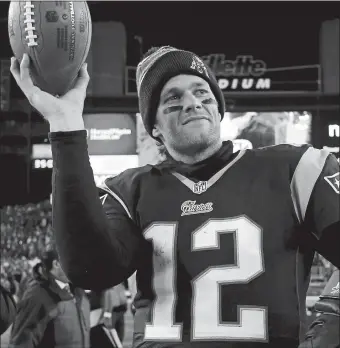  ?? AP FILE PHOTO ?? In this Jan. 10, 2015, file photo, Patriots quarterbac­k Tom Brady holds up the game ball after defeating the Baltimore Ravens in an NFL divisional playoff game. Brady, 42, is leaving New England and will sign a free agent contract with the Tampa Bay Buccaneers.