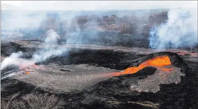  ??  ?? U.S. Geological Survey Lava fountains from the Kilauea Volcano have built a small spatter cone, the black mound at right, from which lava spills out Friday onto the surface and flows into a small pond at left near the town of Pahoa on Hawaii’s Big...