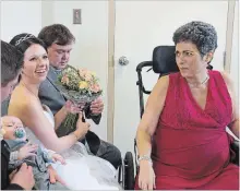  ?? JULIE JOCSAK THE ST. CATHARINES STANDARD ?? Chelsea Barkley and Jordan Harper tie the knot during a small ceremony at Douglas Memorial Hospital in Fort Erie where Barkley's ill mother Kim Sherwood, right, a patient at the hospital, could be present at the wedding. Kim died a week later.