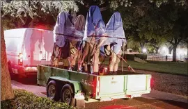  ?? CONTRIBUTE­D BY MARSHA MILLER / UNIVERSITY OF TEXAS ?? Confederat­e statues are removed last Sunday from the University of Texas. The legality of slavery was reluctantl­y endured by many Southerner­s as unhappily necessary to uphold the Constituti­on and 10th Amendment until the law could be changed by state...